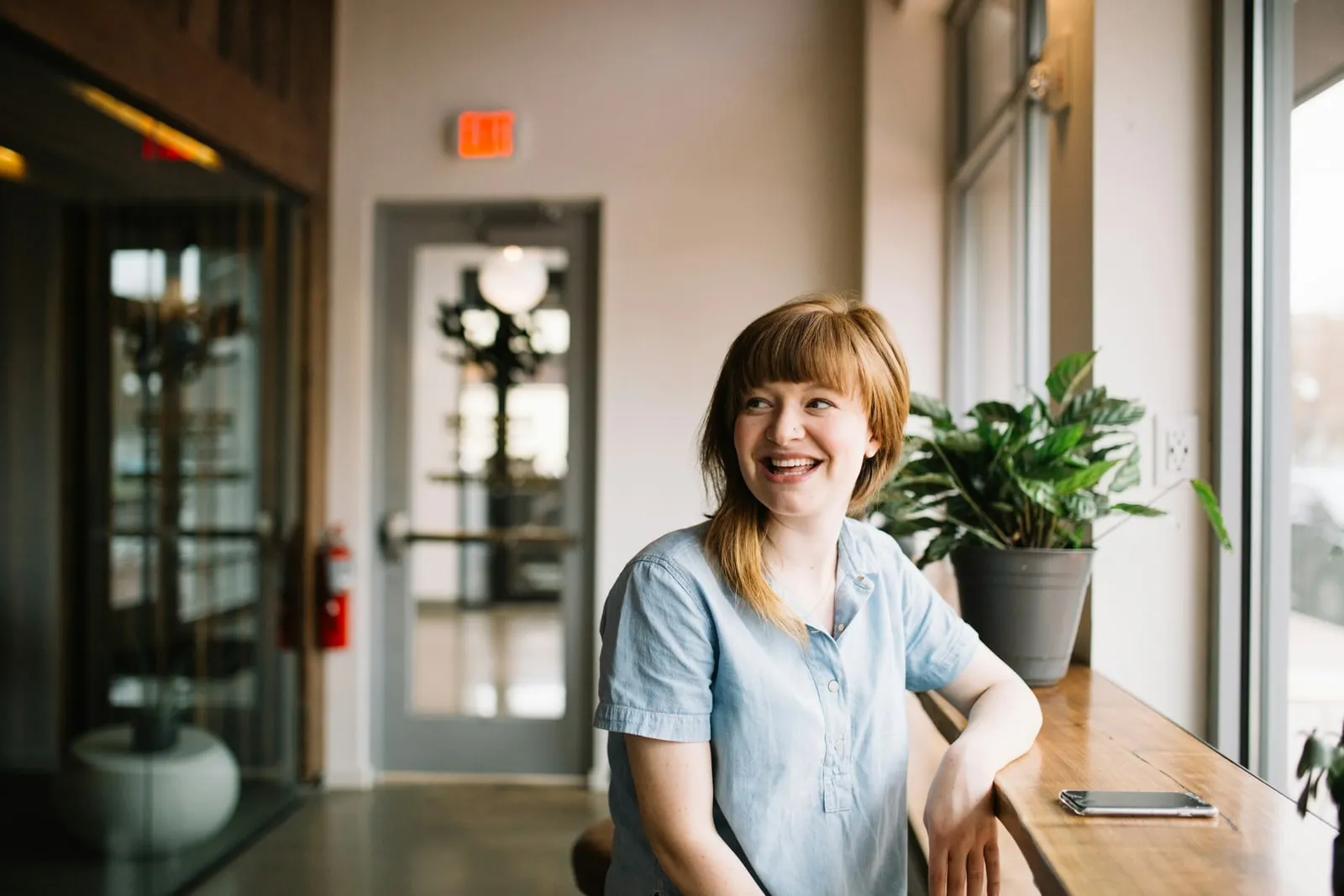 An employee smiling, relaxed at work